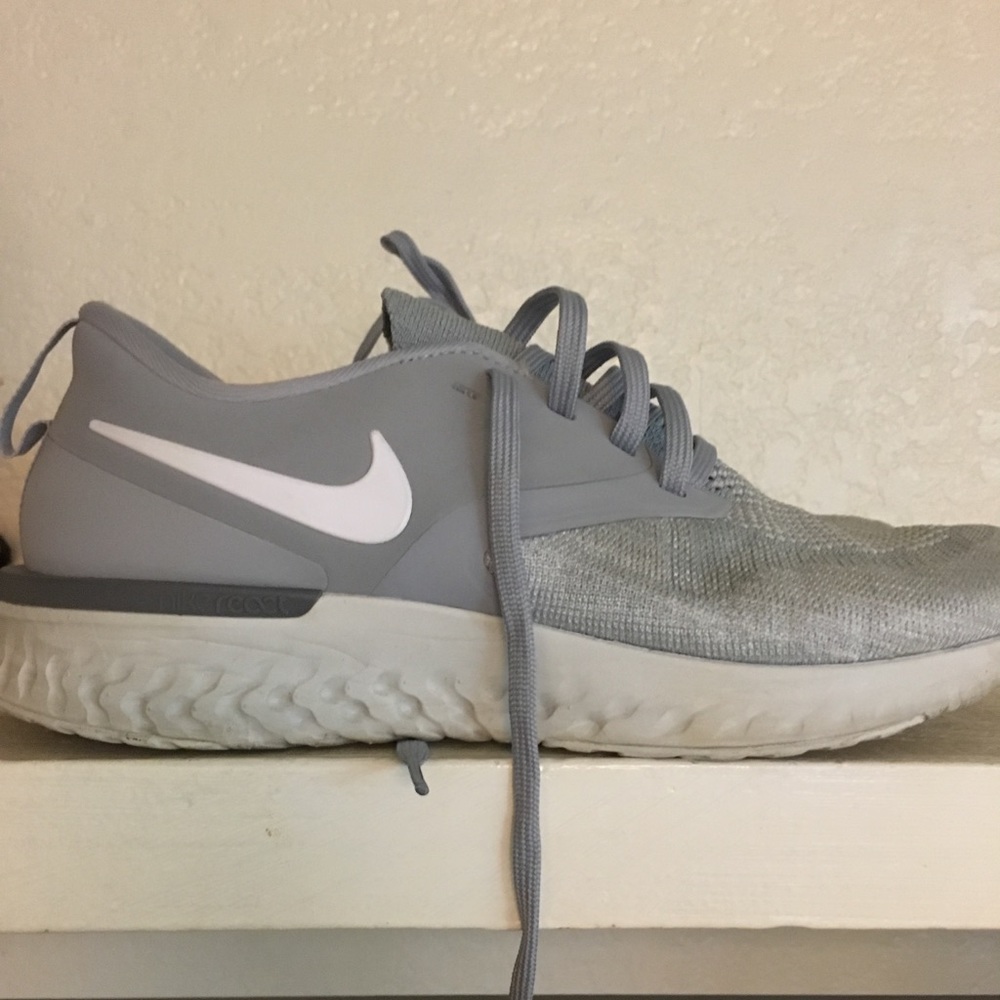 Silver Nike running shoes